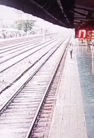 Woman Calmly Walks Across The Train Tracks To Her Death