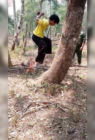 Myanmar Police Torture A Civilian By Hanging Him Over A Fire