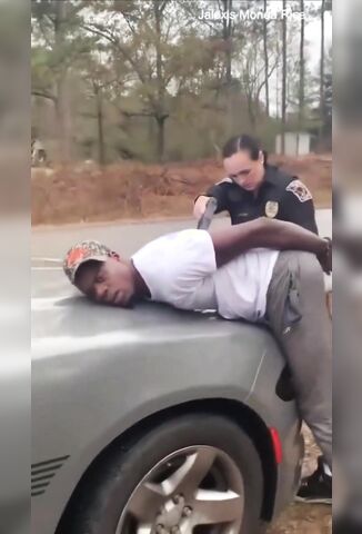 Smirking White Deputy Tazers Handcuffed Black Dude On The Hood Of His Car