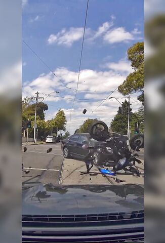 Biker Tries To Beat The Lights