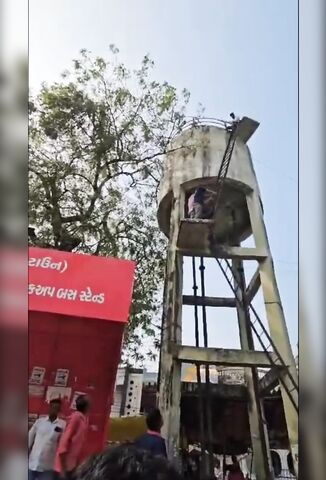 Man Threatening To Jump From Water Tower Accidently Falls On The Way Down