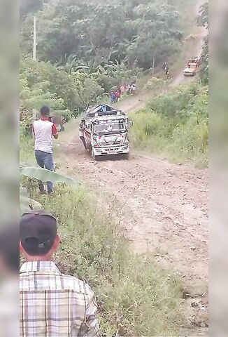 Man Riding On The Side Of A Truck Falls Under The Wheels