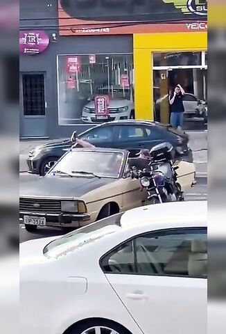 Bikers Catch A Lift In A Turning Car