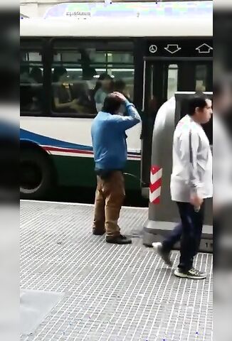 Man Pisses In The Street And washes His Hair With It