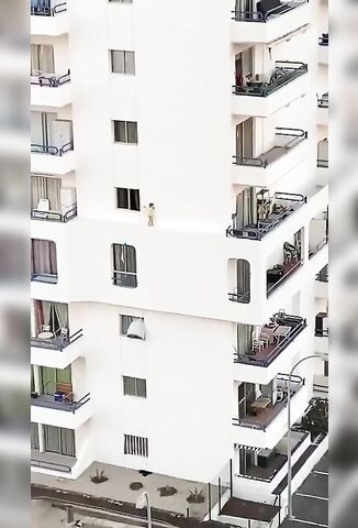 Child Walks Along Building's Edge Unsupervised