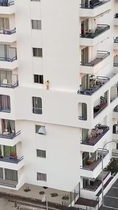 Child Walks Along Building's Edge Unsupervised