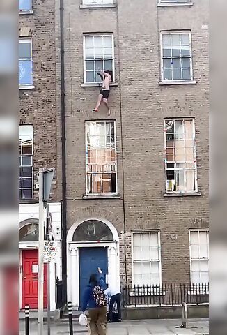 Crazed Guy Falls From Window Onto A Spiked Fence