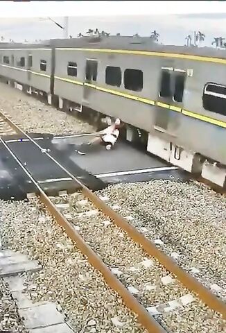 Guy On A Bicycle Plays Chicken With A Train And Loses