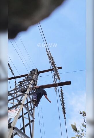 Man Checking Out An Electricity Pylon Gets A Big Surprise