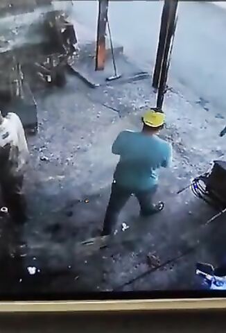 Guy Sweeping The Garage Floor Shot By Two Bandits