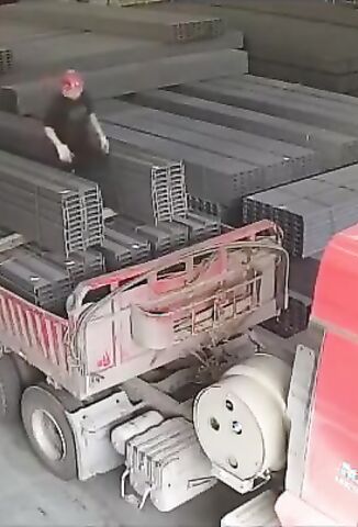 Man Working On Top Of A Truck Has His Legs Crushed By Steel Cargo