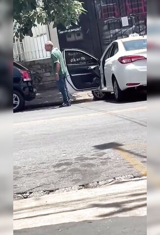 Biker Throws All He's Got At Old Taxi Guy Who Takes It Rather Well