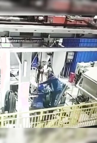 Workers Pressed Into Oblivion By The Machine He's Working On