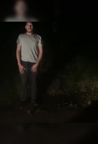 Man Standing On A Dirt Road Shot In The Head And Stabbed In The Back