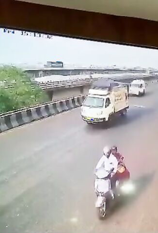 Biker Falls Under The Wheels Of Passing Truck And Pops