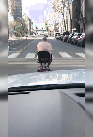 Naked American On A Mobility Scooter - Only In America