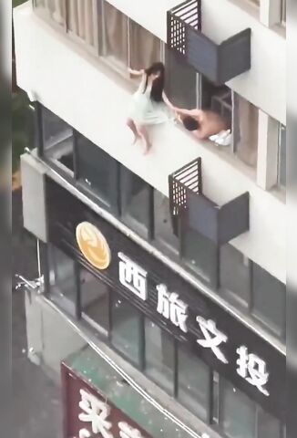 Woman Falls From Apartment Complex And Adjusts Her Dress After Landing