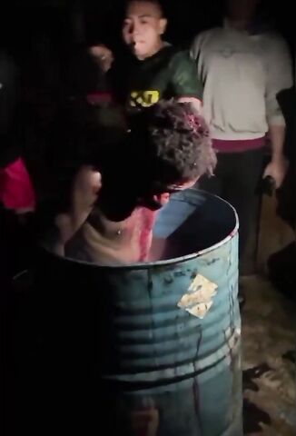 Black Man Tied Up And Put In A Barrel of Water Brutally Beaten And Sliced By Captors