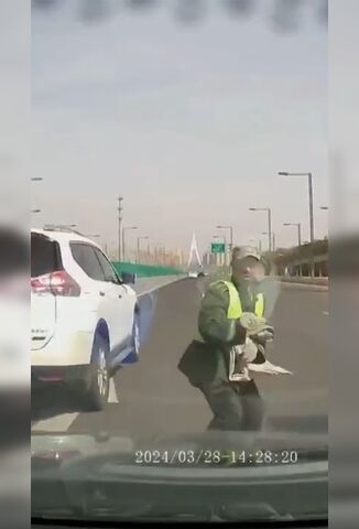 Man Standing In The Middle Of The Highway Gets A Visit From A Car