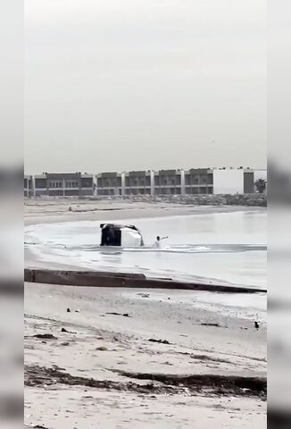 SUV Racing On The Beach Flips And Ejects Driver - But He Just Walks Away