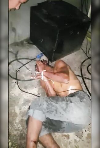 Bound Man Tortured With Electricity By Laughing Gang