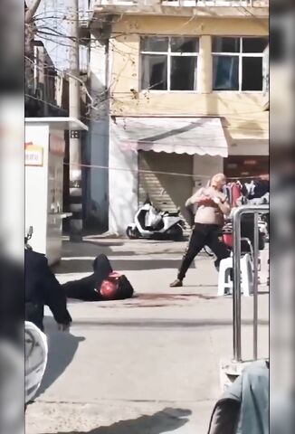 Crazed Man Slices His Own Neck Multiple Times In The Street After Stabbing Another