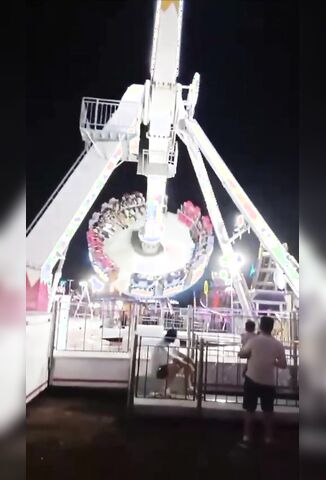 Carni Tries To Move His Dog Outta The Way And Gets Flattened By Carnival Ride