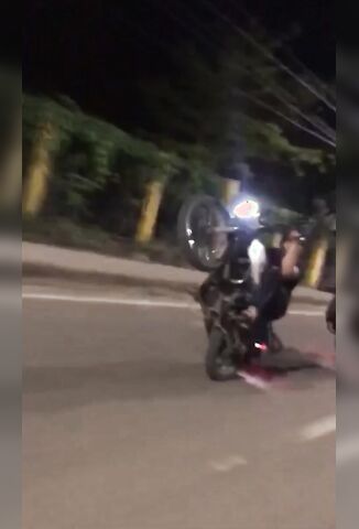 Biker Slams Into Another Mid Wheelie Sending Him Into A Fit