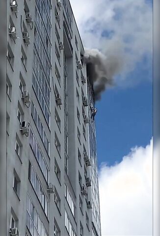 Man Hanging From A Burning Building Can't Hang On Any Longer