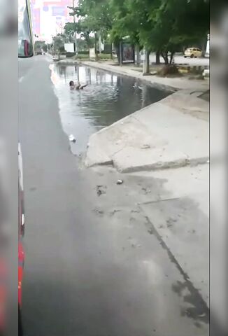 Crazed Ass Naked Lady Swimming In A Puddle In Brazil