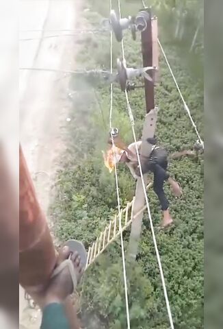 Man Working On Overhead Wires Accidently Touches Them With His Head