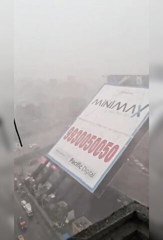 Monster Advertising Billboard Falls Onto Street Of Queuing Cars