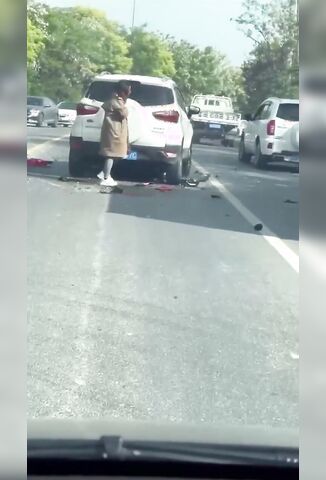 Biker Stuck Under Car Waving His Hand For Help