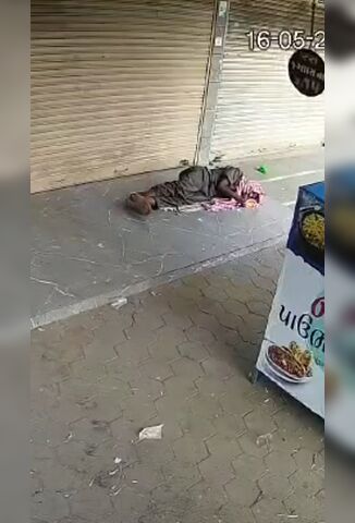 Homeless Man Sleeping On The Street Becomes A Parking Space