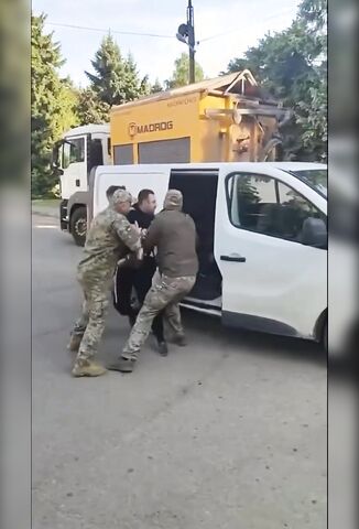 Ukrainian Soldiers Try To Force Conscription On Man With His Family Watching On