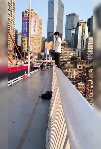 Depressed Chinese Guy Suicides Backwards Off A Very Tall Bridge