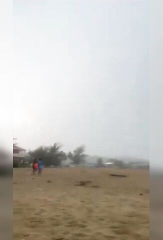 Lighting Strikes And Kills Three Huddling Together On The Beach