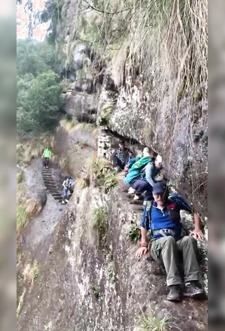 Tourist Takes The Quick Way Down The Mountain