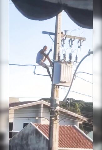 Crazed Lunatic Climbs Electricity Pylon With Obvious Consequences