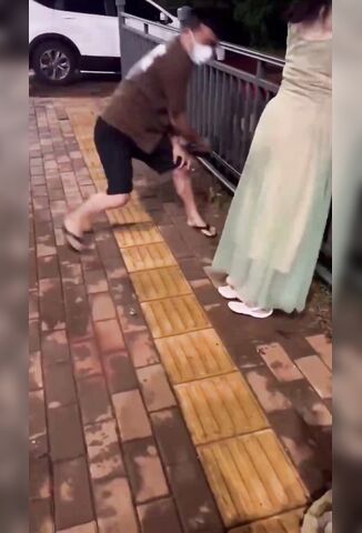 Girl Gets Beaten With A Belt In Public In Weird Chinese Punishment