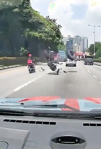 Spare Tyre Wipes Out Biker