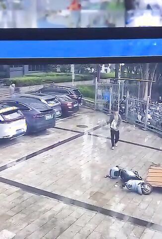 Roof Board Falls Off Landing On Unsuspecting Scooter Rider