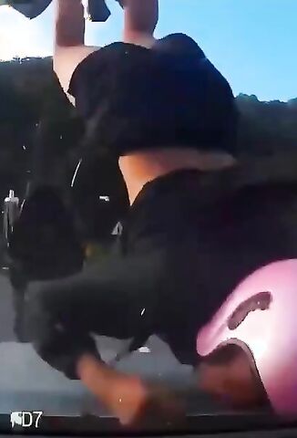 Sudden Impact Leaves Pink Helmet Wearing Rider In A World Of Pain