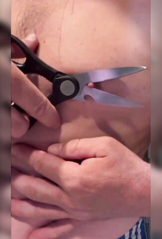 Man Loses A Bet So Removes His Nipple With A Pair Of Scissors