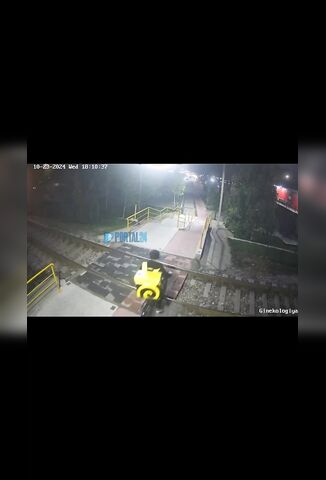 Courier With Headphones On Oblivious To Oncoming Train