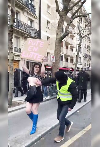 Topless Sex Worker Protester Gets A Helping Hand With Her Cause