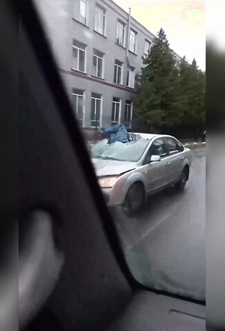 Cyclist Tying To Avoid A Puddle Ends Up Becoming Part Of A Cars Windshield