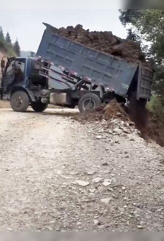 Truck Driver Dumping The Load Becomes One With The Load