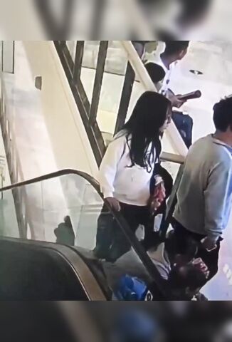 Girl Not Paying Attention Dragged To Her Death By The Escalator Rail