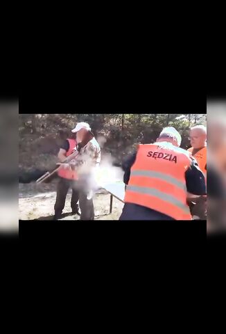 Old Dude With A Safety Vest Forgets The First Rule Of Gun Safety